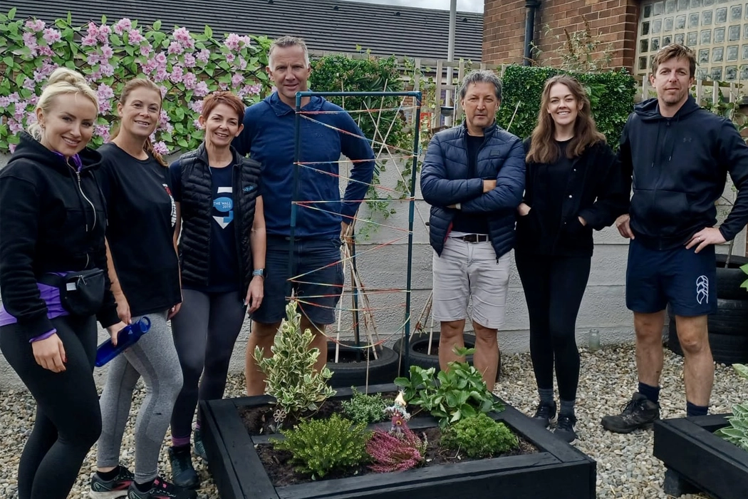 ASL volunteers in the ABEN garden at The Brick after a corporate volunteer day, September 2024.